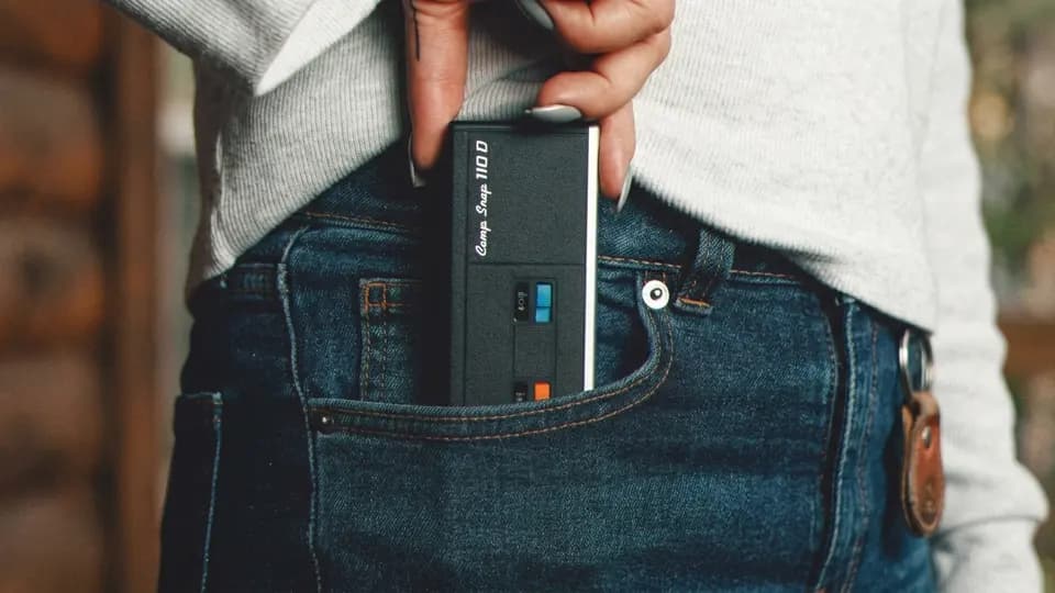 Camp Snap 110D screenless camera slipped into a jeans pocket
