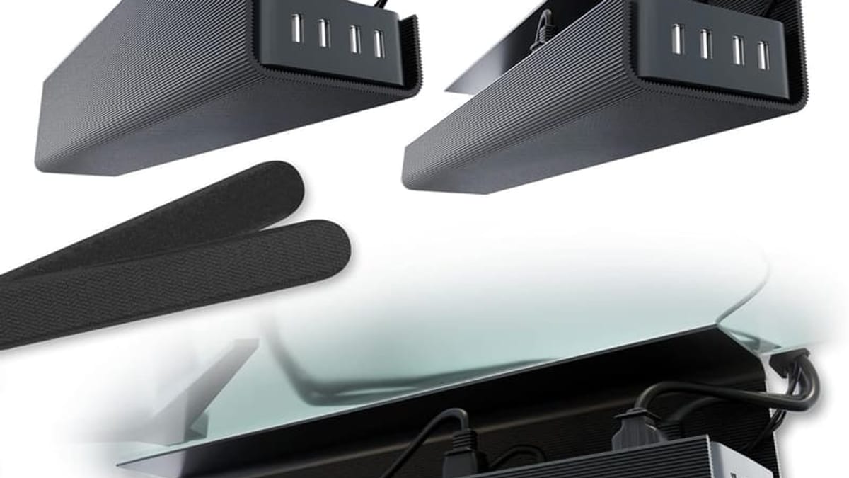 Under desk cable management tray holding power strip