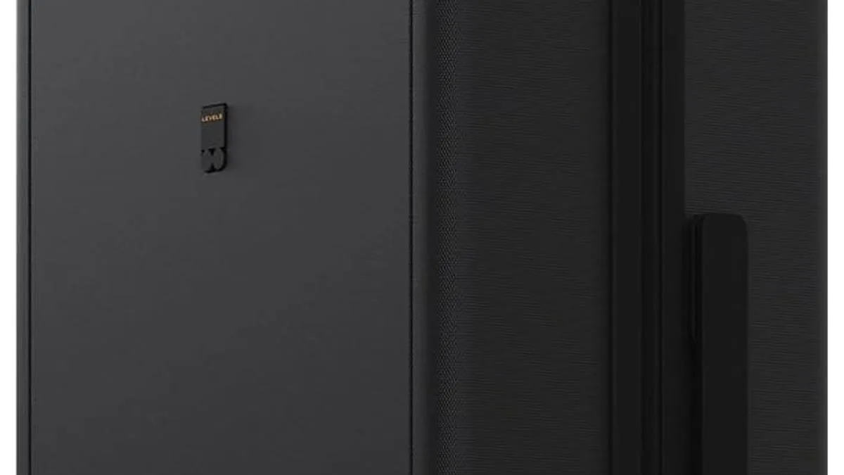 Carry-on suitcase next to airline size measuring box