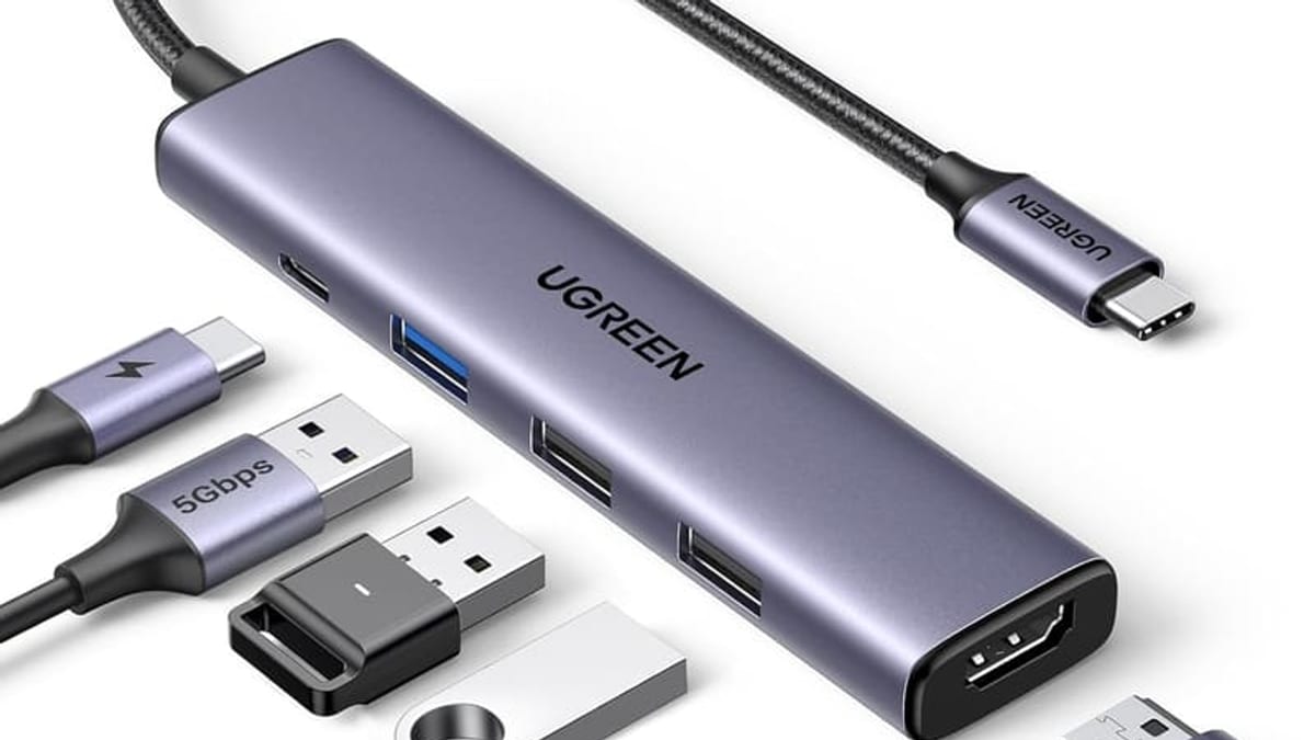 USB-C hub, charger and wireless charging accessories on a desk