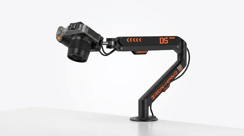 JINRAIKO overhead camera mount with 360° adjustable arm holding a camera on a white desk